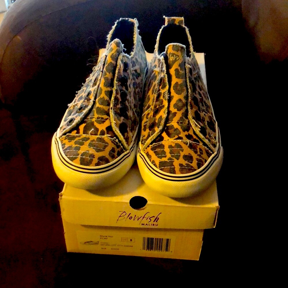 Sneakers slightly worn.  Comes with box in excellent condition.